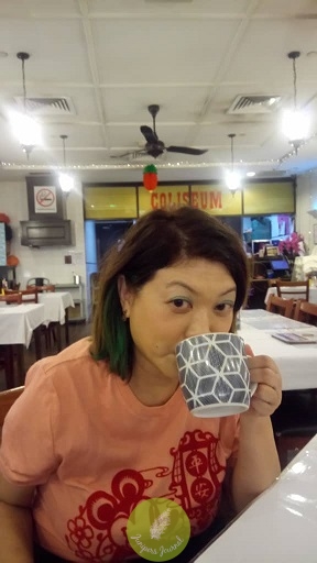 Sipping on teh tarik while waiting for omelet set